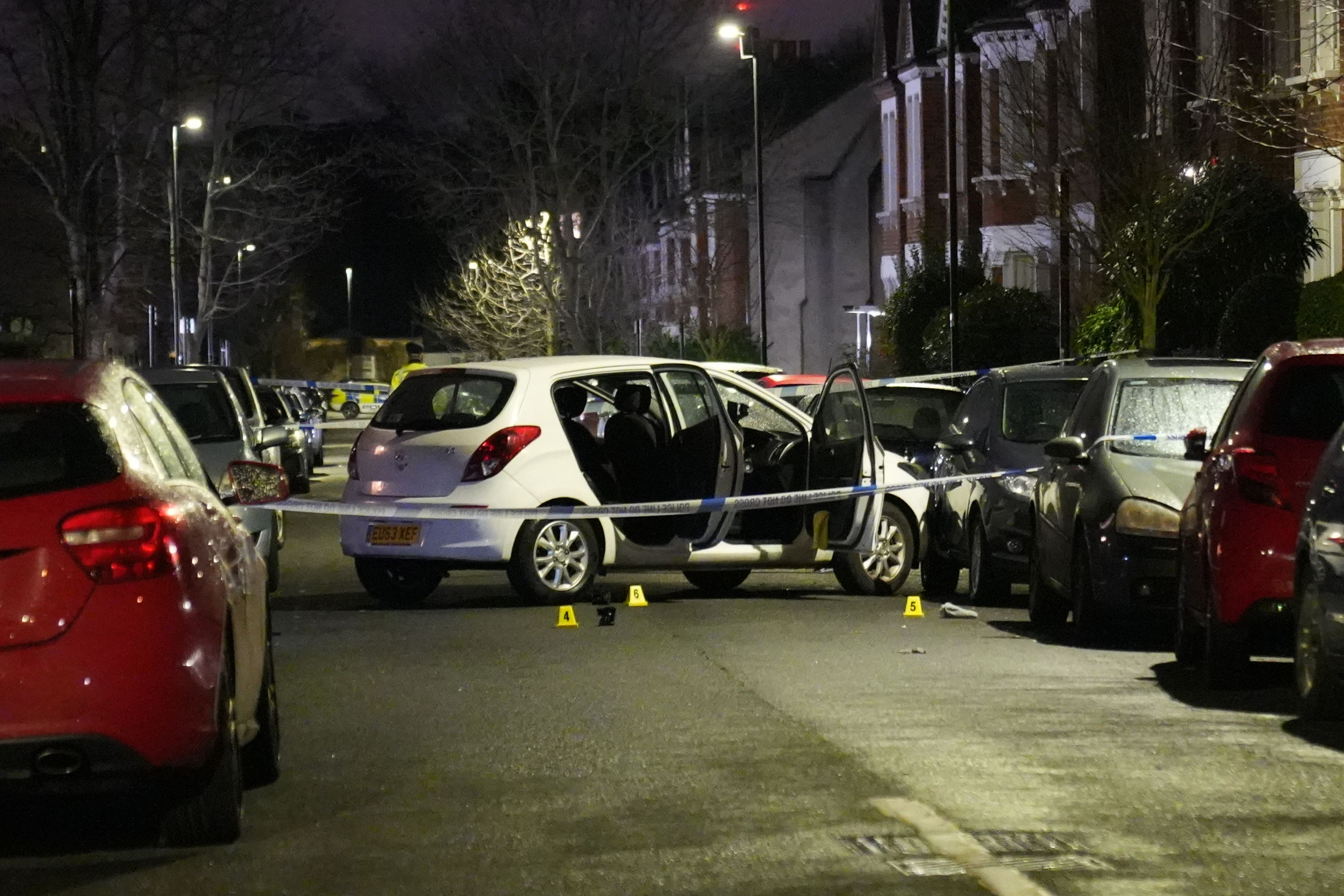 Police at the scene of the attack in Lessar Avenue near Clapham Common