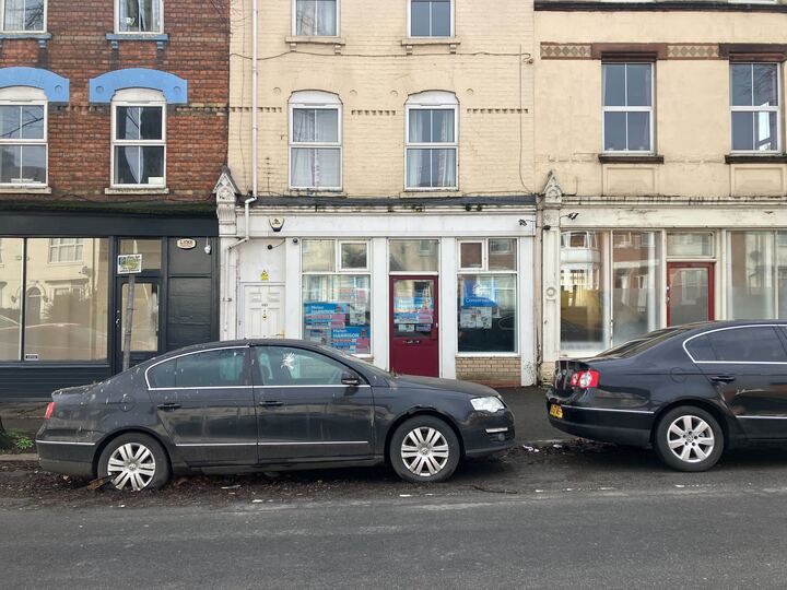 A clamped car sits outside Helen Harrison’s derelict campaign office