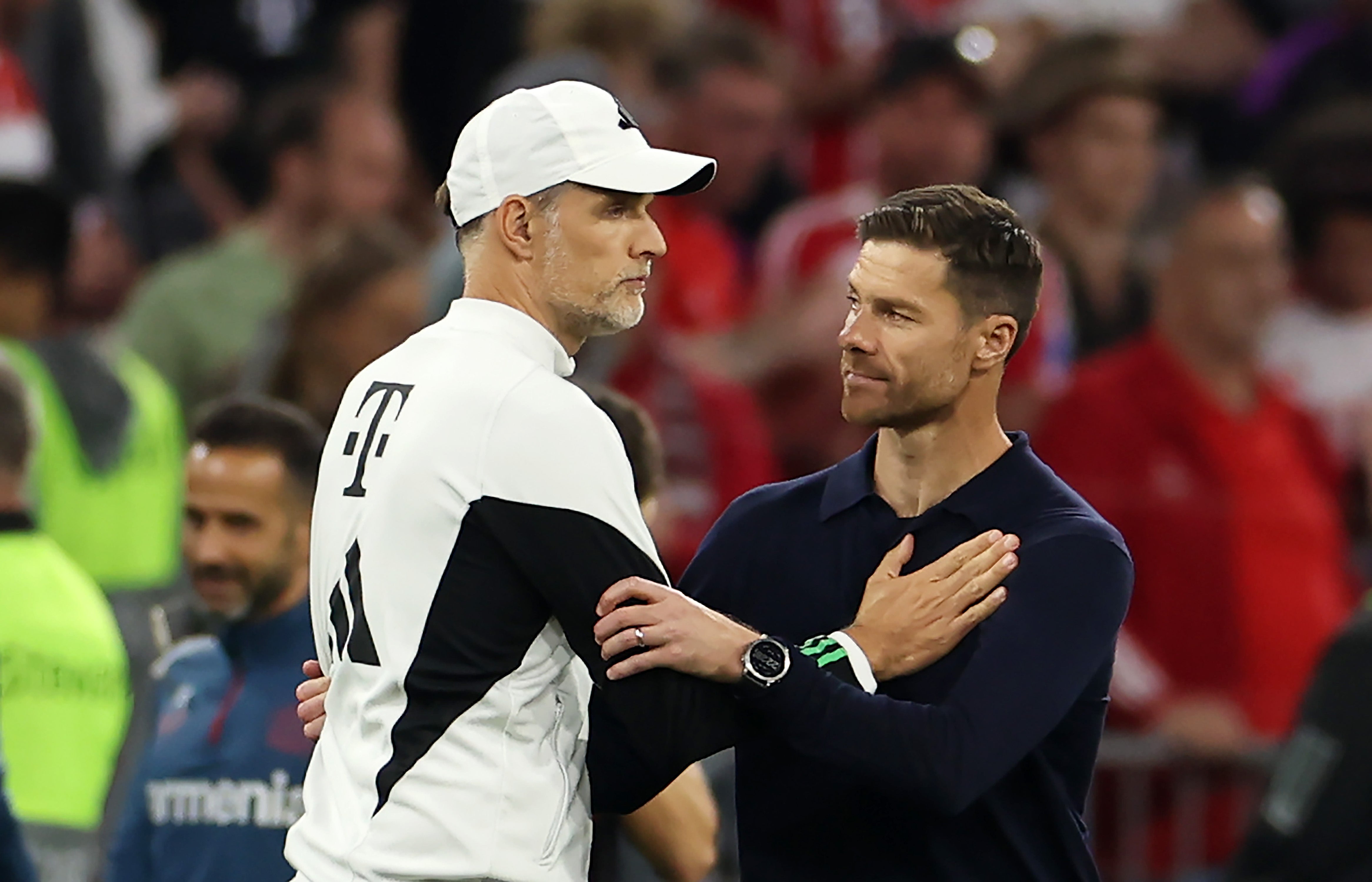 Tuchel is consoled by Xabi Alonso after defeat by Leverkusen