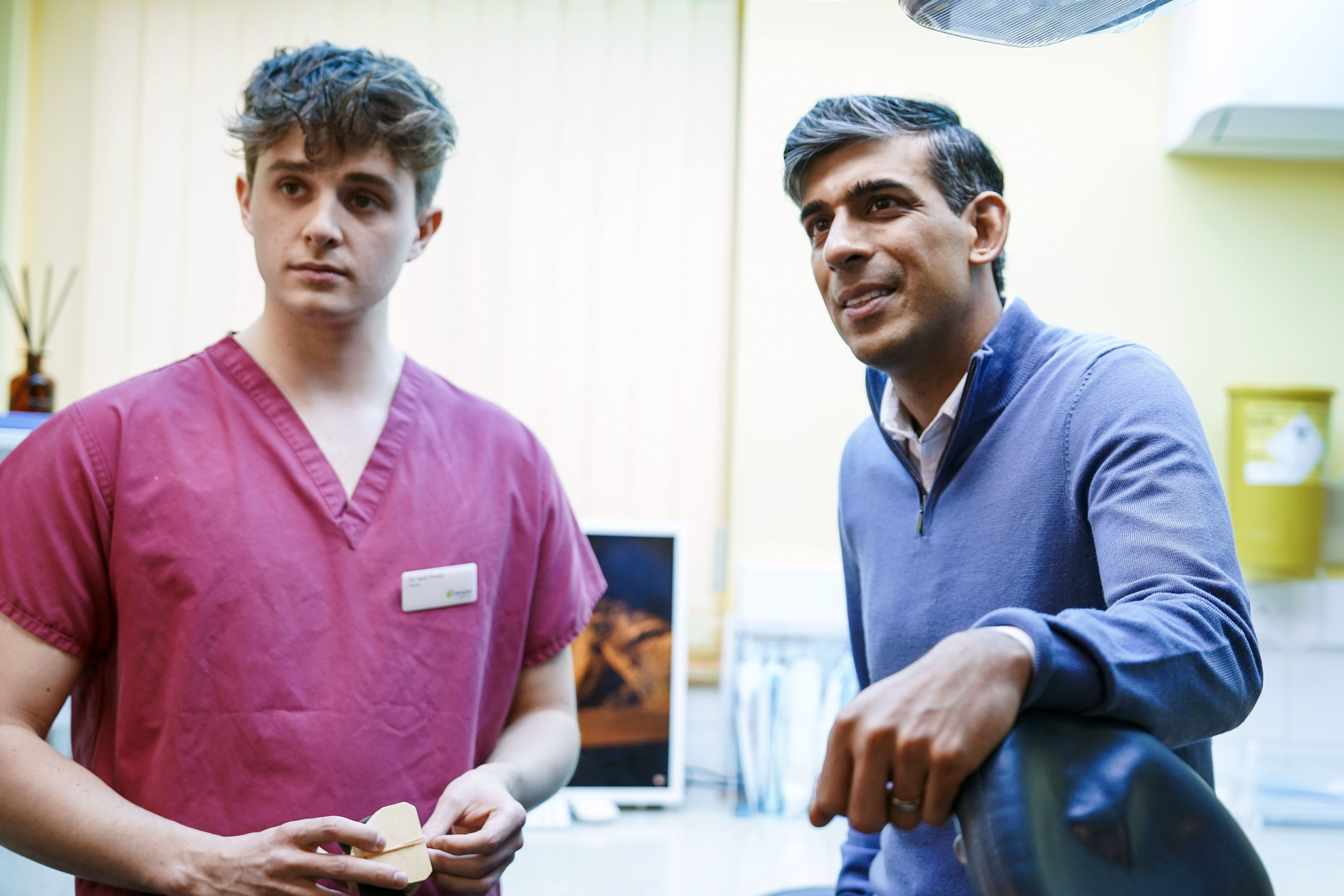 Prime Minister Rishi Sunak talking to staff during a visit to Gentle Dental in Cornwall.