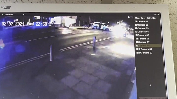 <p>Moment armed police raid pizza takeaway where chemical attack suspect Abdul Ezedi worked .</p>