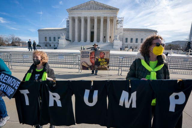 <p>Protesters demonstrate outside the US Supreme Court on 8 February as justices heard arguments in a case that could see Donald Trump disqualified from office. </p>