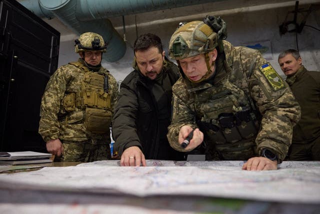 <p>Volodymyr Zelensky (C-L) and Colonel General Oleksandr Syrskyi (C-R) visiting a Ukraine’s army command post in Kupiansk, Kharkiv region</p>