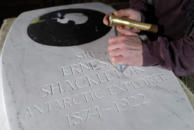 Stonemason Will Davies adds the finishing touches to a memorial stone for Sir Ernest Shackleton, ahead of a dedication in Westminster Abbey on February 15 (Andrew Matthews/PA)