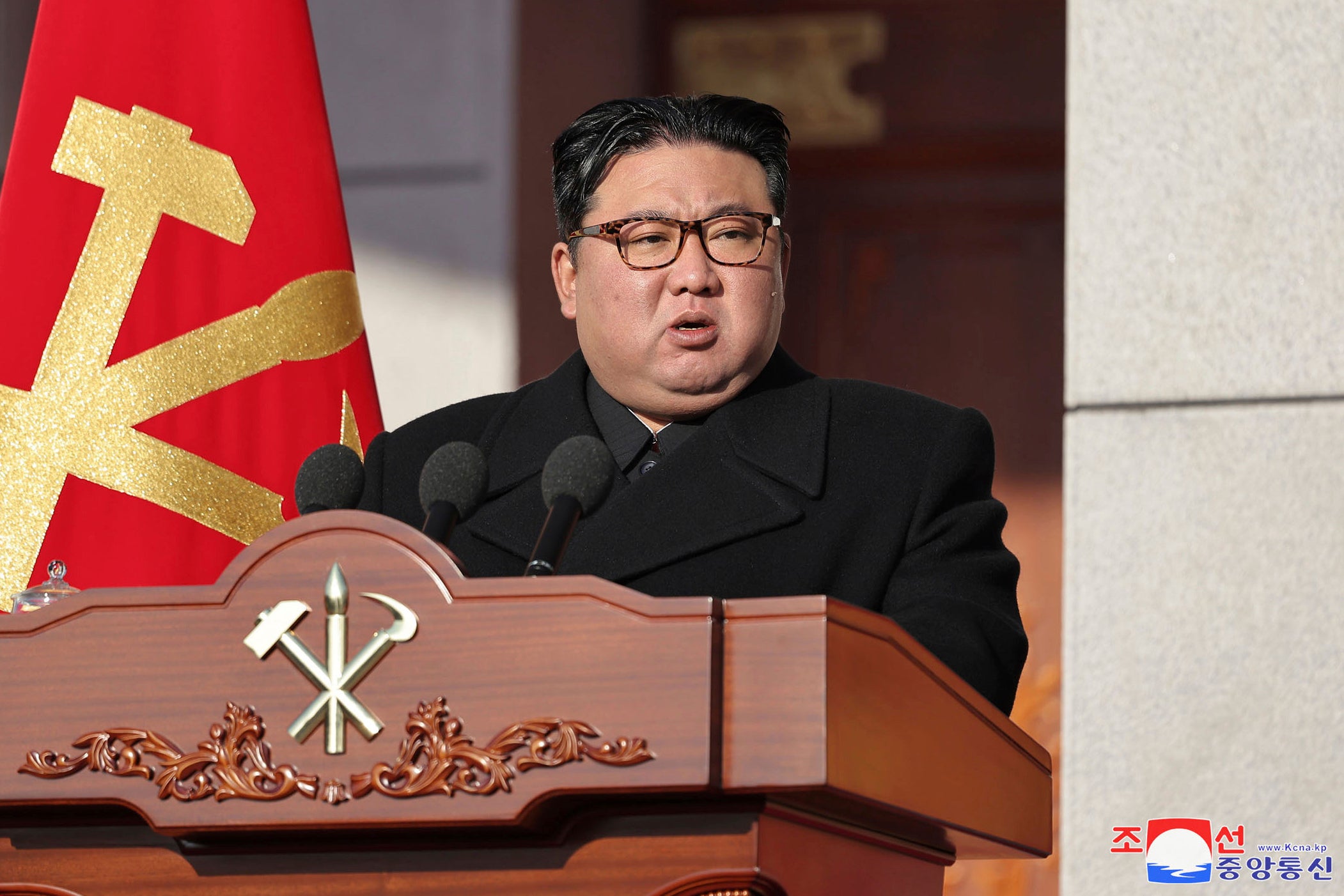 In this photo provided by the North Korean government, its leader Kim Jong Un speaks during an event
