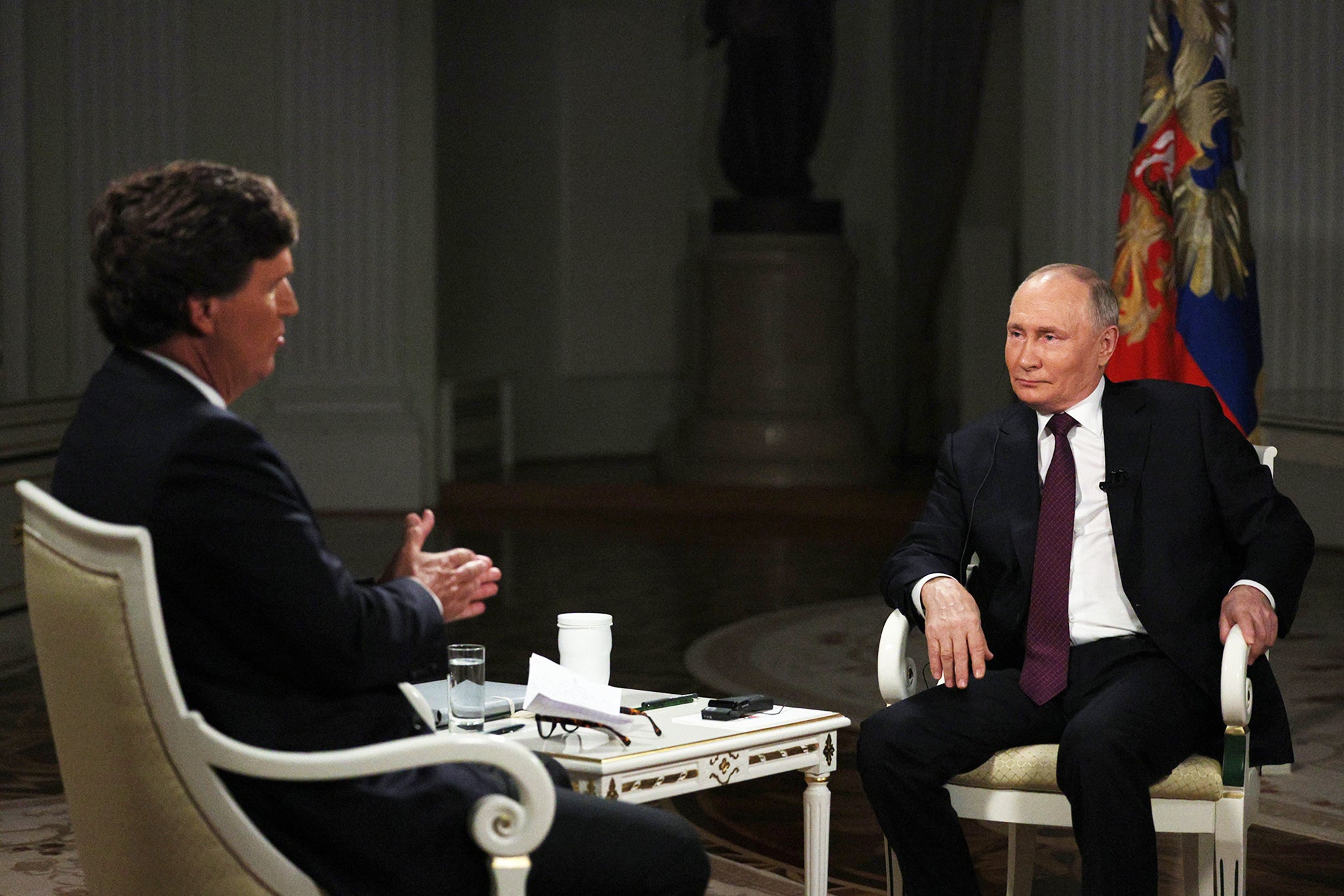 Conservative pundit Tucker Carlson speaks to Putin at the Kremlin in Moscow, in a widely-derided interview