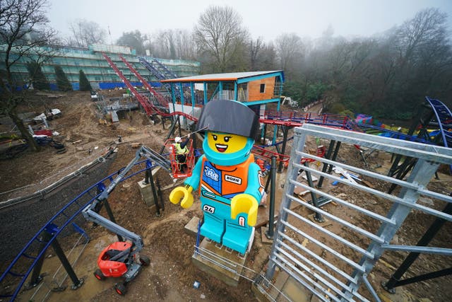 Lead creative Hannah ‘Phiz’ Phizacklea tends to the world’s tallest Lego minifigure, Roxie (Jonathan Brady/PA)