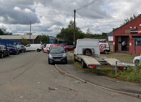 Two men have been arrested after a teenager died at a business premises in Tile Street in Bury
