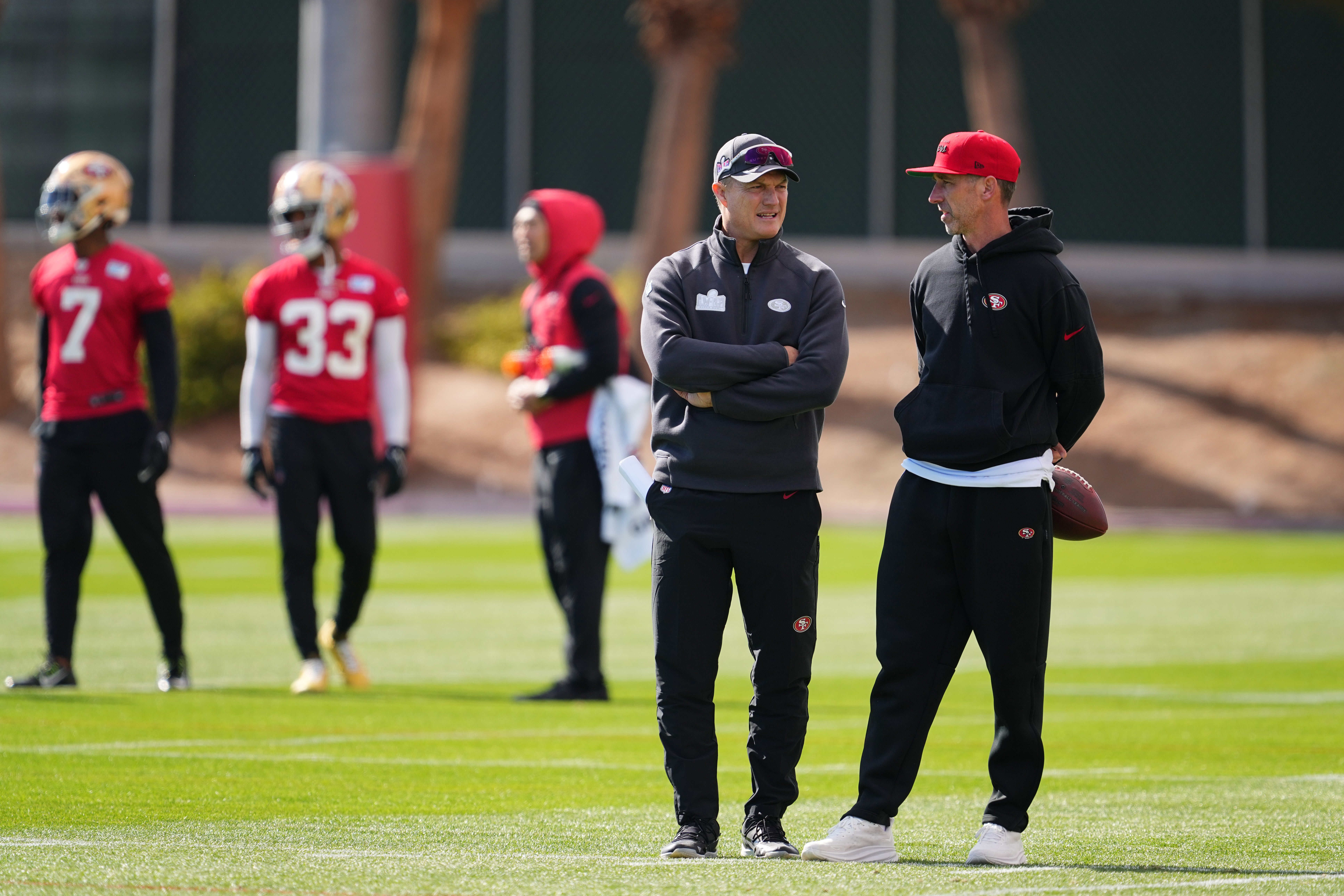 General manager John Lynch and head coach Kyle Shanahan speak during San Francisco 49ers practice
