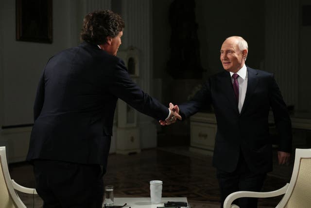 <p>In this pool photograph distributed by Russian state agency Sputnik, Russia's President Vladimir Putin gives an interview to US talk show host Tucker Carlson at the Kremlin in Moscow on February 6, 2024</p>