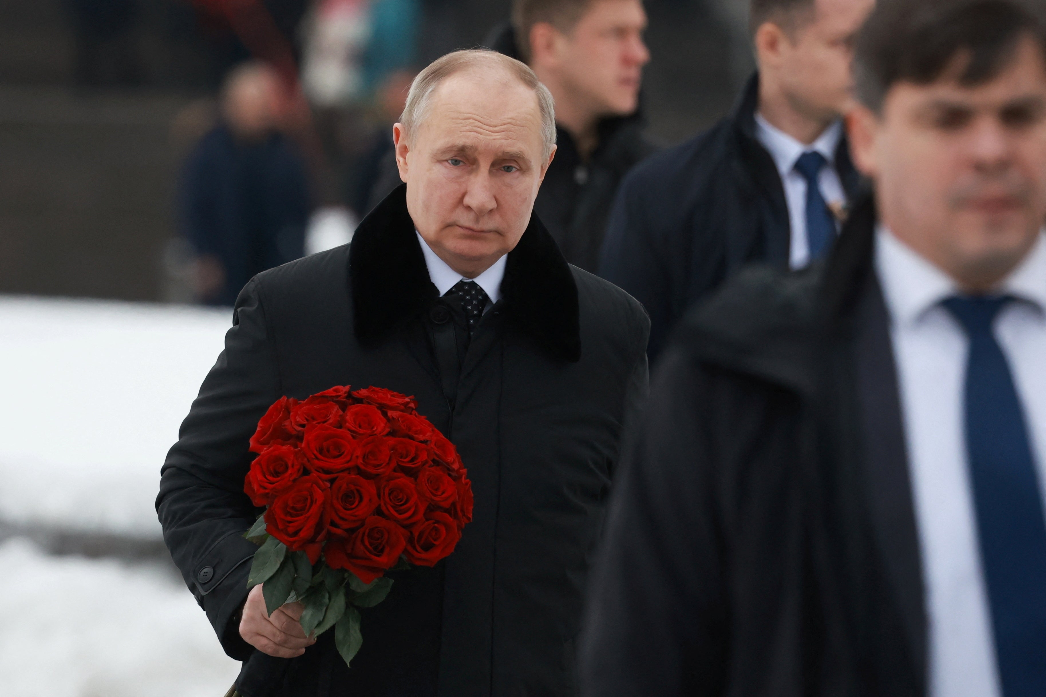 President Vladimir Putin attends a flower-laying ceremony at the Motherland monument at Piskarevskoye Memorial Cemeter