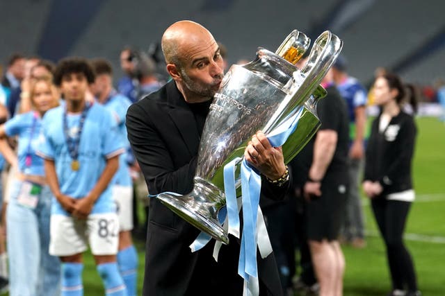 Pep Guardiola has dismissed talk of another glorious treble (Martin Rickett/PA)