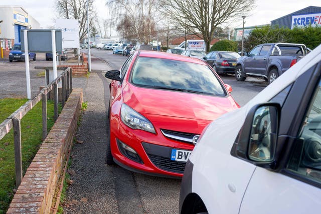 <p>Powers to ban pavement parking should be extended across England to make streets safer, according to a report published by councils</p>