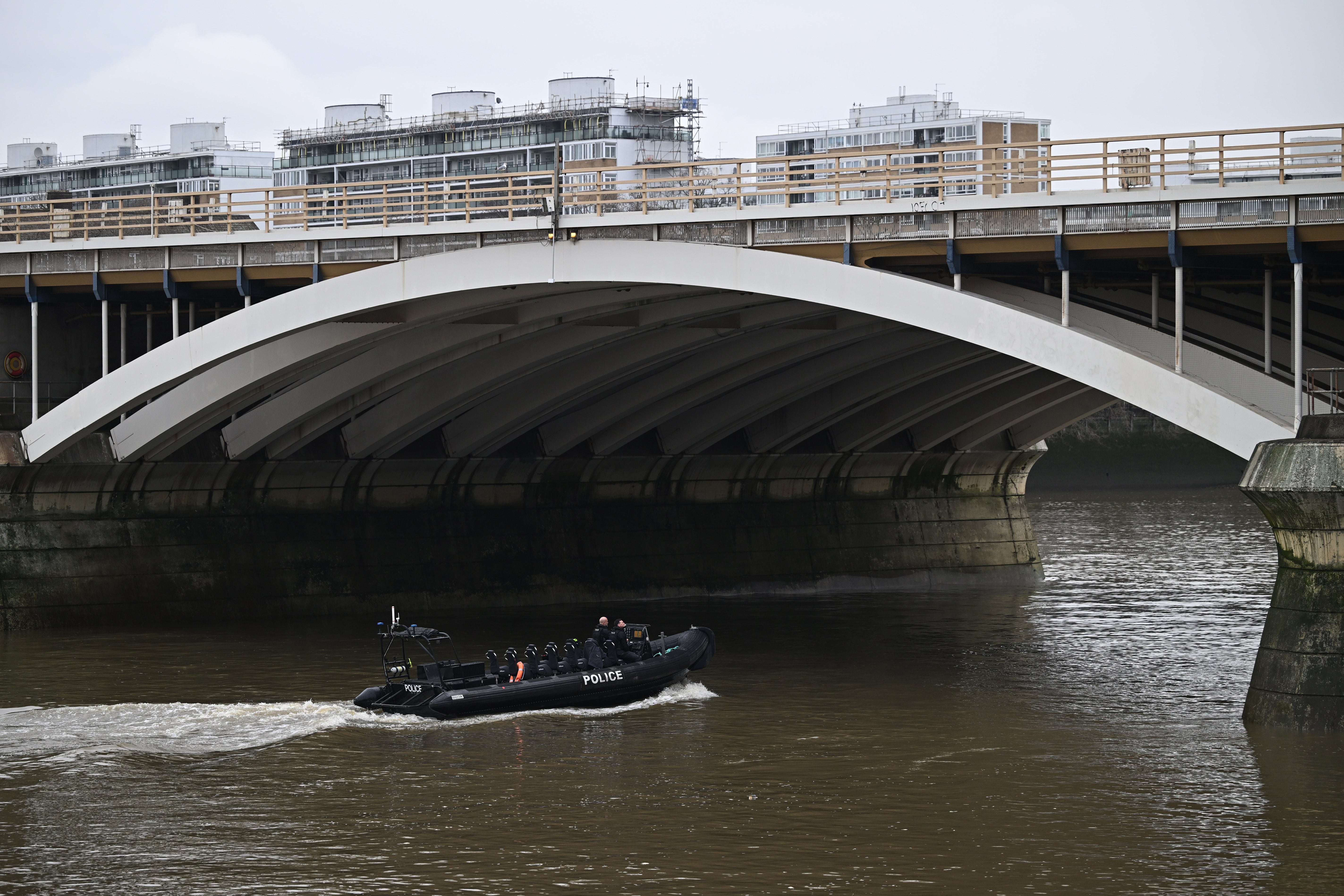 Police boats are spotted searching the Thames near Chelsea Bridge on Saturday February 10