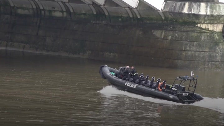 Police boats search the Thames near Chelsea Bridge for alkali attack suspect Abdul Ezedi