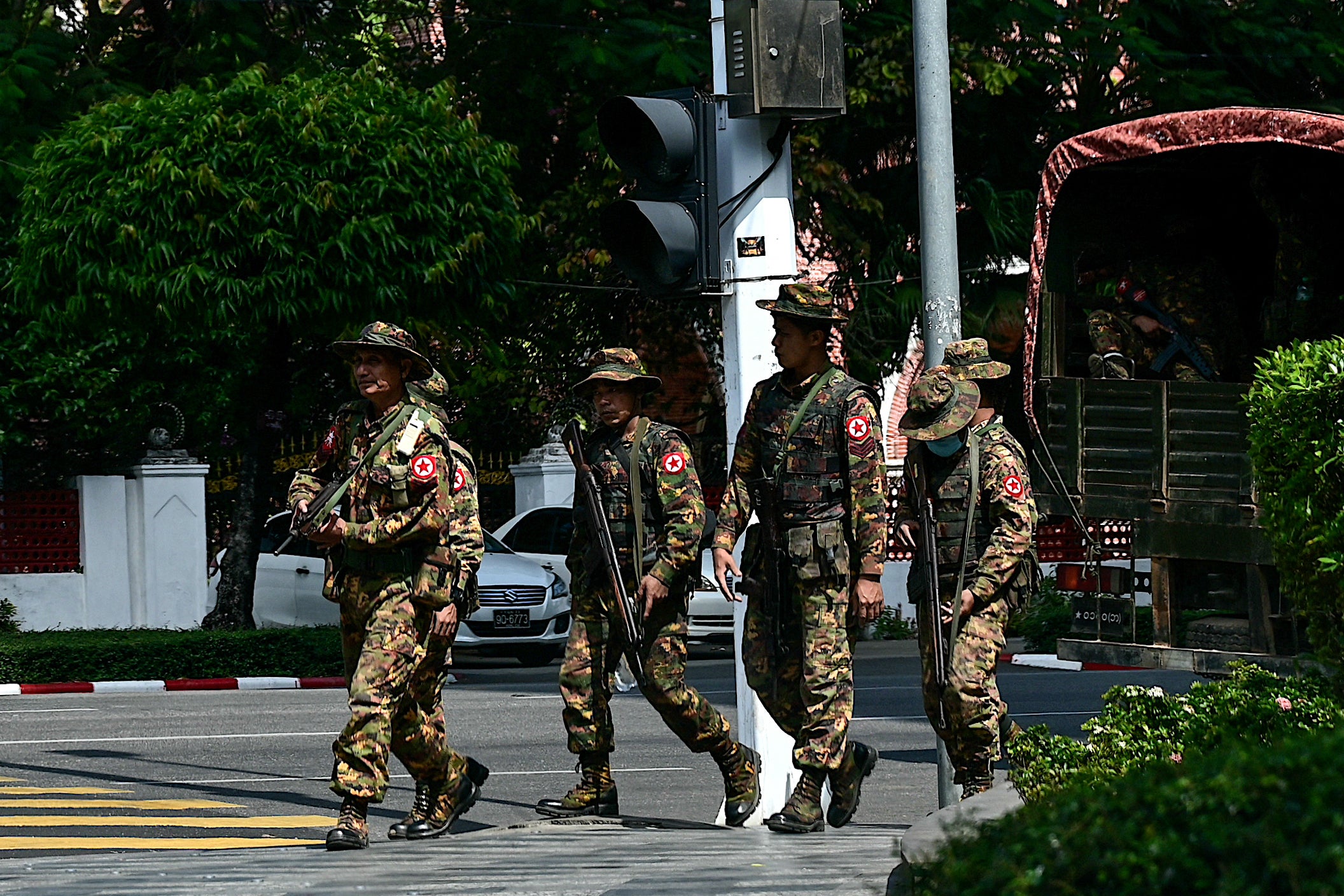 <p>Members of the Myanmar’s military security force patrol a street during a “silent strike” to protest and to mark the third anniversary of the military coup in Yangon on February 1, 2024</p>