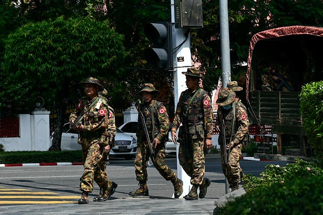 <p>Members of the Myanmar’s military security force patrol a street during a “silent strike” to protest and to mark the third anniversary of the military coup in Yangon on February 1, 2024</p>