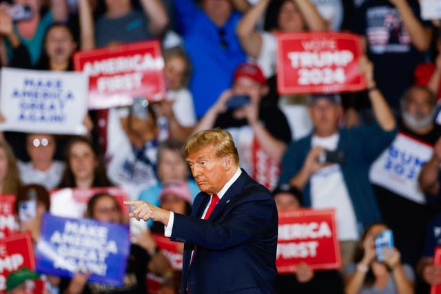 <p>Former US President and 2024 presidential hopeful Donald Trump gestures at supporters at a “Get Out the Vote” Rally in Conway, South Carolina, on February 10, 2024</p>