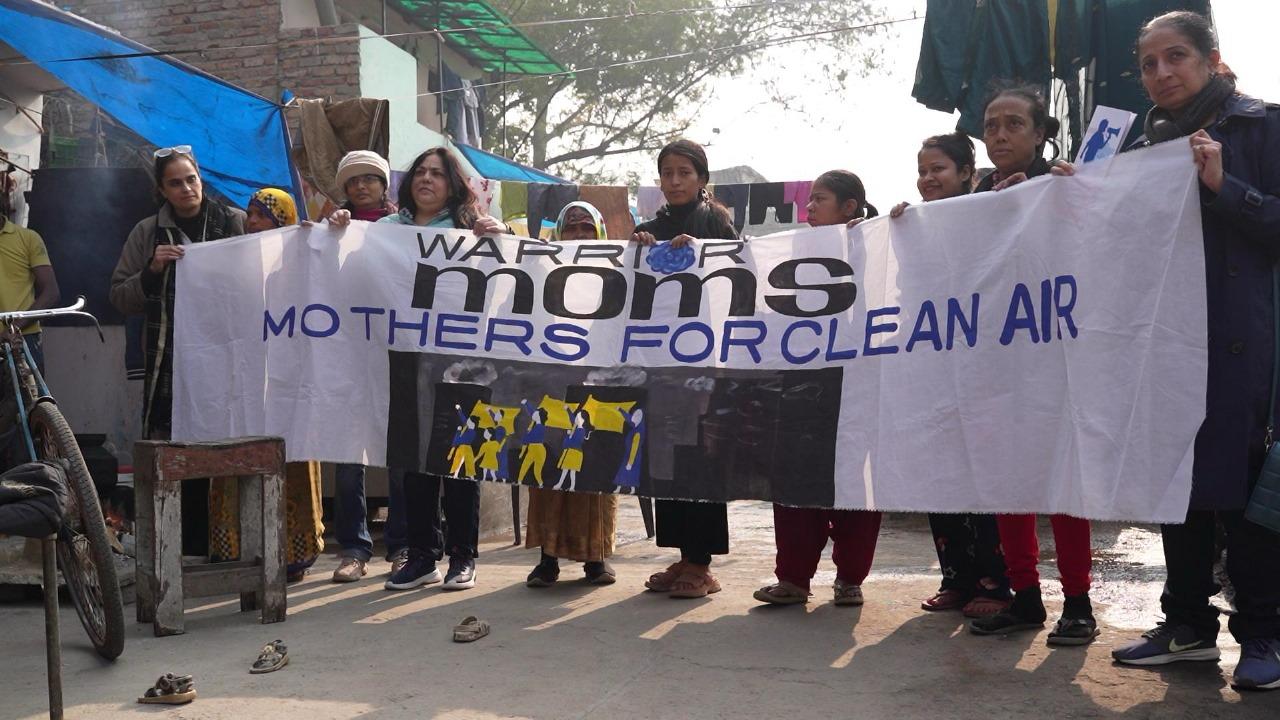 Bhavreen Kandhari (left), standing with members of Warrior Moms, a coalition of women fighting for their children’s right to breath clean air