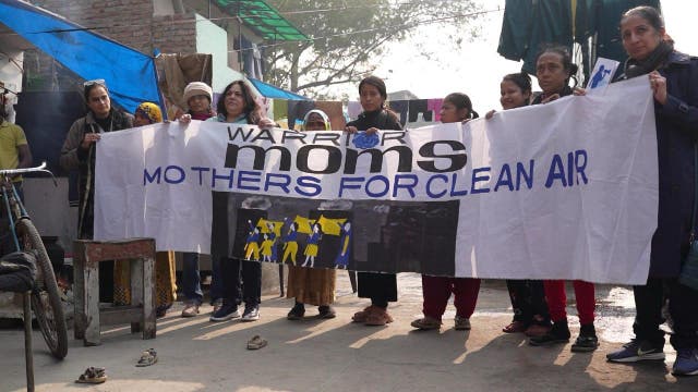 <p>Bhavreen Kandhari (left), standing with members of Warrior Moms, a coalition of women fighting for their children’s right to breath clean air</p>