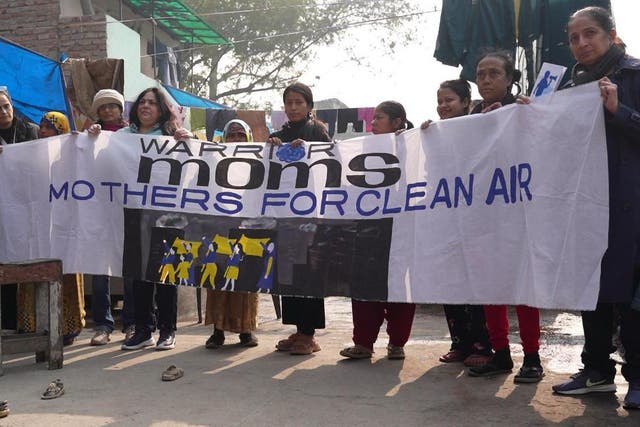 <p>Bhavreen Kandhari (left), standing with members of Warrior Moms, a coalition of women fighting for their children’s right to breath clean air</p>