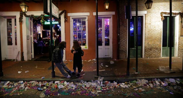 <p>Trash lines the gutter on Bourbon Street, in the early hours of the morning after Mardi Gras, in New Orleans, Feb. 18, 2015</p>