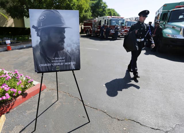 <p>Firefighters arrive to attend a memorial for Charles Morton, the US Forest Service firefighter who was killed in the line of duty in the El Dorado Fire</p>