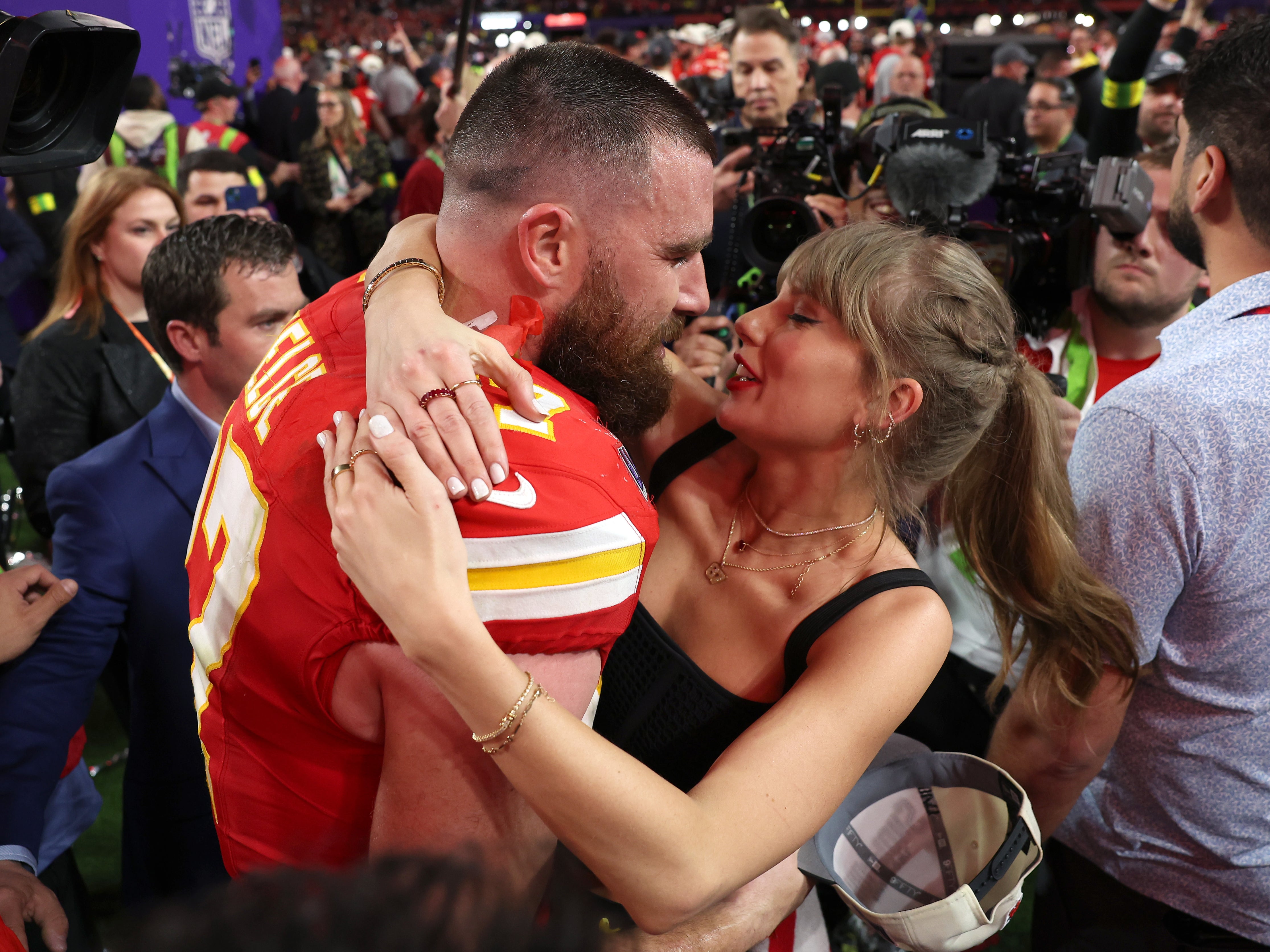 Taylor Swift and Travis Kelce embrace at the Super Bowl 2024