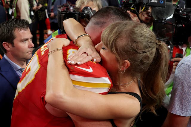 <p>Travis Kelce and Taylor Swift embrace after the Super Bowl </p>