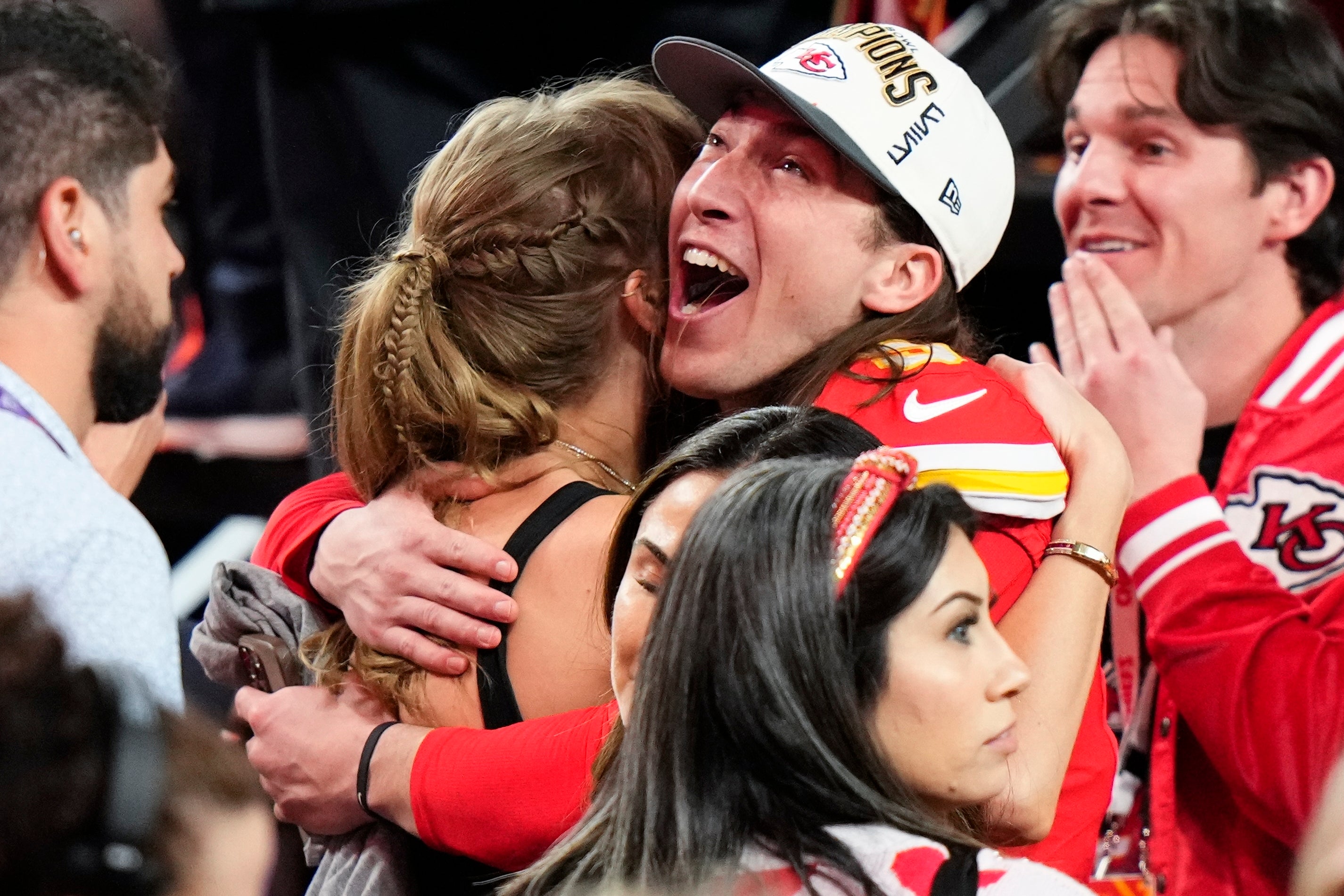Kansas City Chiefs kicker Harrison Butker embraces Taylor Swift after the NFL Super Bowl 58 against the San Francisco 49ers