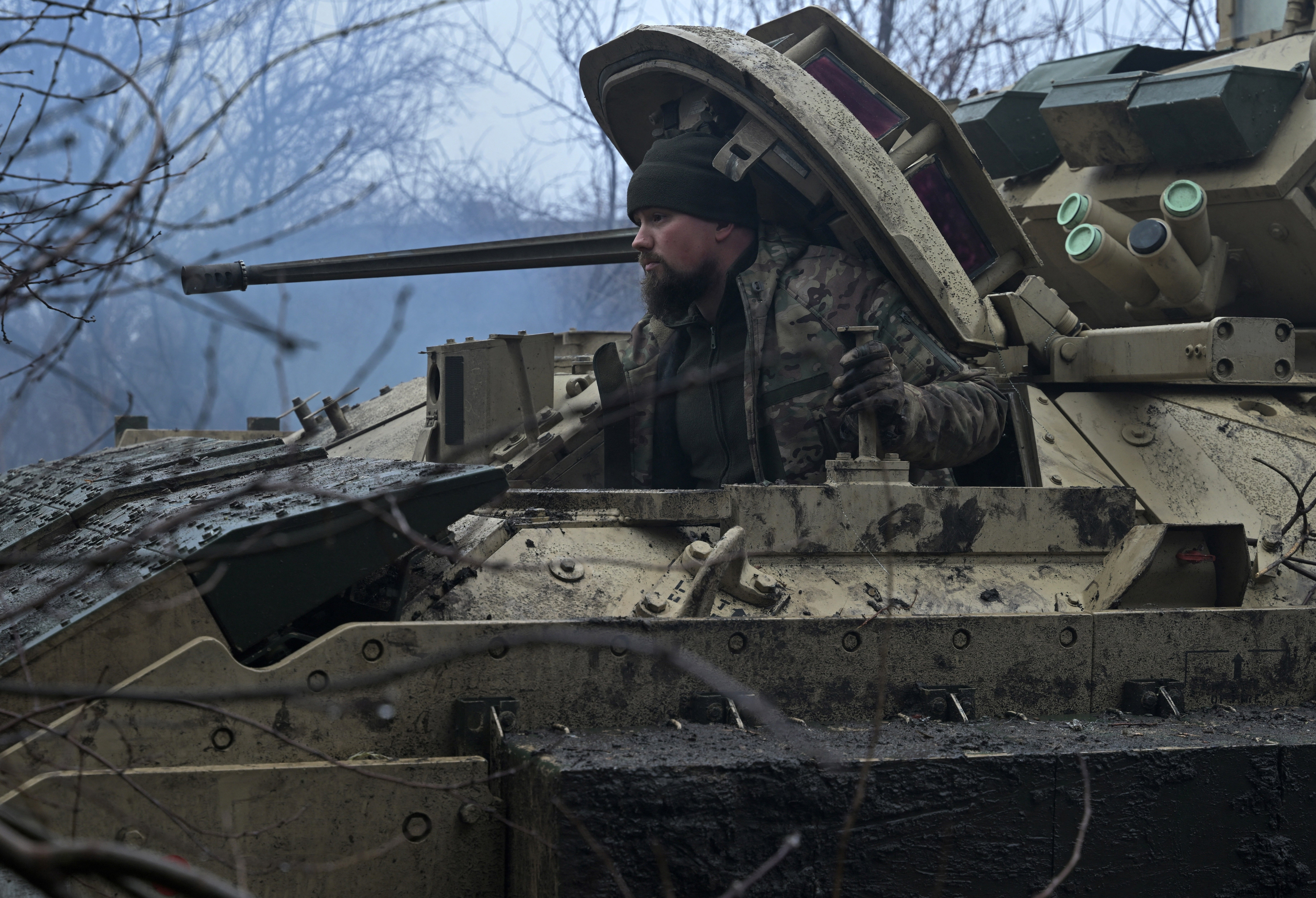 A Ukrainian serviceman of the 47th Mechanised Brigade prepares for combat in a Bradley fighting vehicle, not far away from Avdiivka, Donetsk region