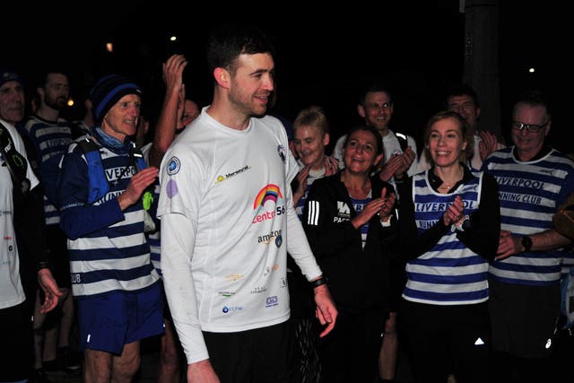 Alex Rigby has completed an ultra-marathon which saw him run 56 miles to all 37 stations on Merseyrail’s Northern Line in aid of domestic abuse charity Centre 56 (James Malone/PA)