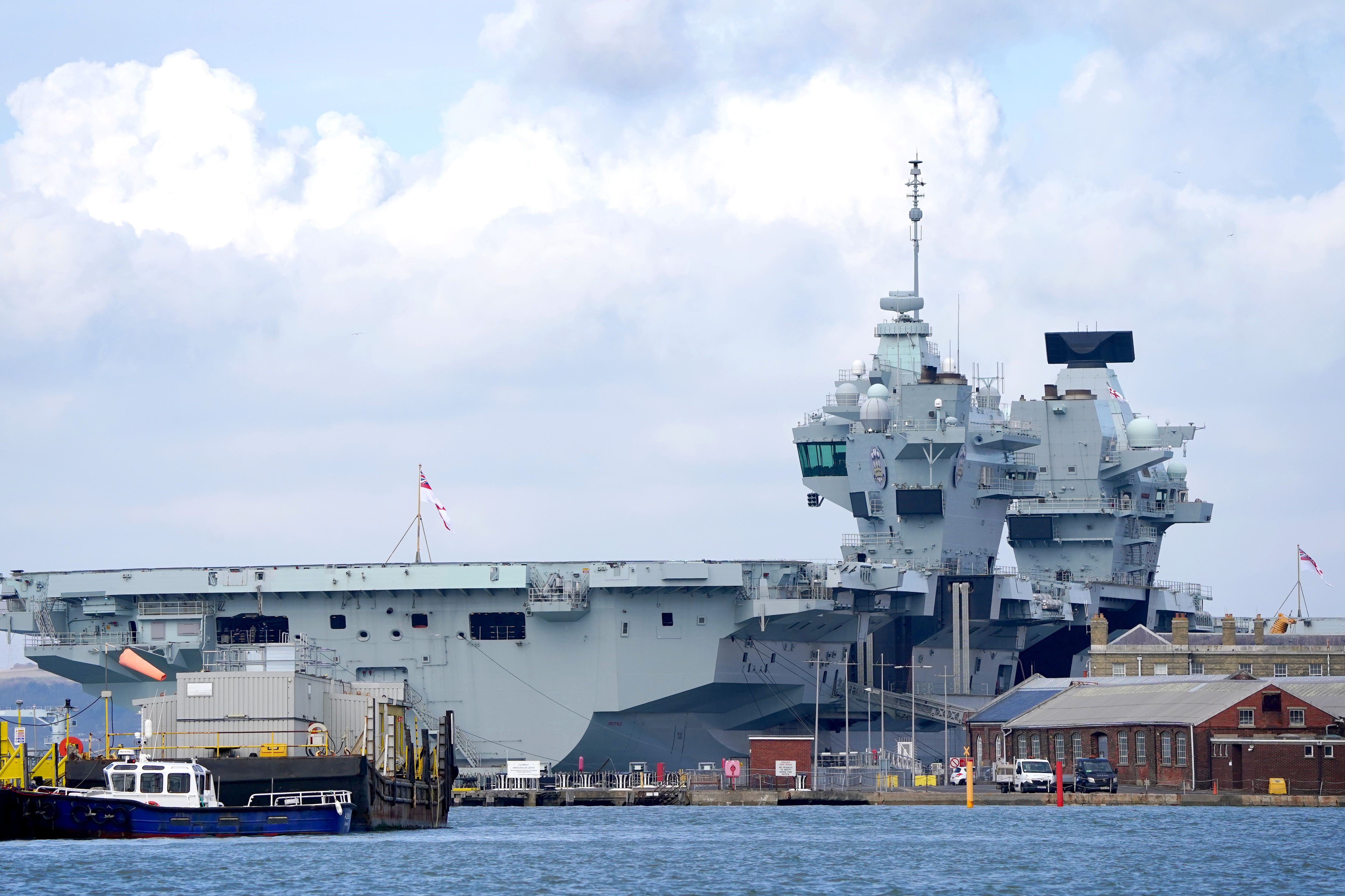 Security minister Tom Tugendhat has said it is ‘not acceptable’ that Royal Navy warship HMS Prince of Wales is sitting in dock when it should be out ‘defending our interests abroad’ (Gareth Fuller/PA)