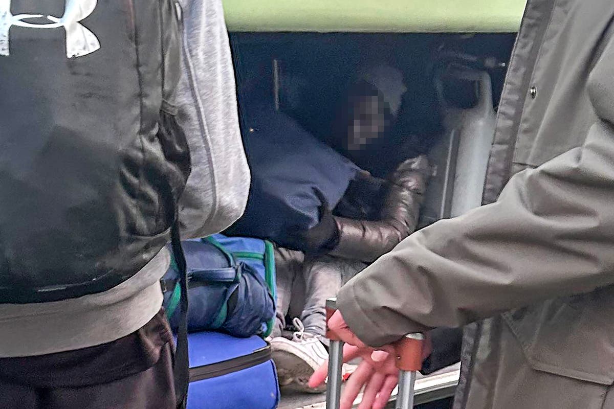 Two suspected migrants found in luggage hold on school coach after French trip