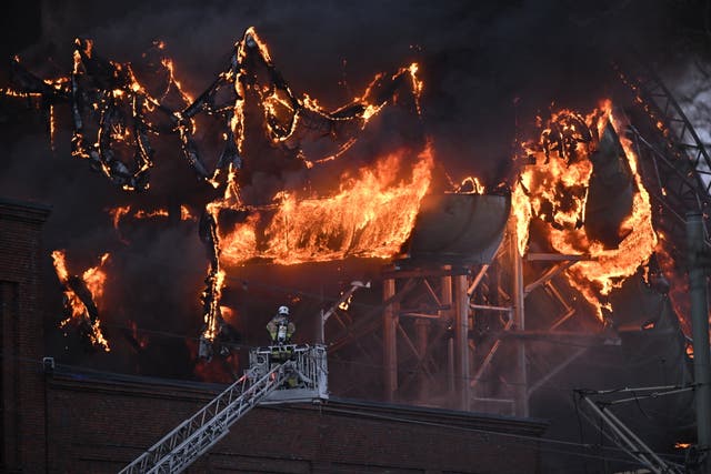 <p>Firefighters in action after a fire broke out at the Liseberg amusement park</p>