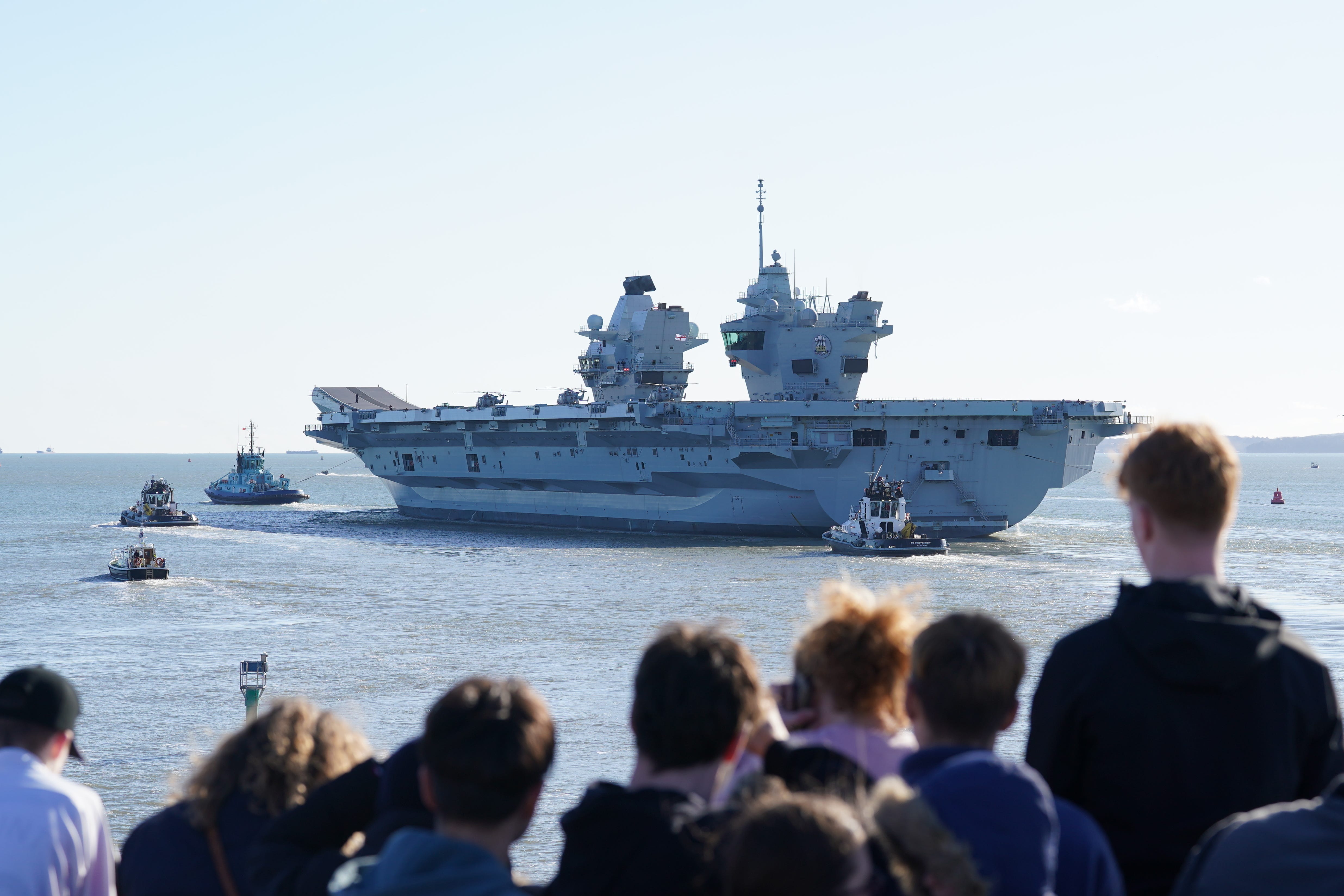 Royal Navy aircraft carrier HMS Prince of Wales sets sail from Portsmouth Harbour following a delay to its departure (Gareth Fuller/PA)