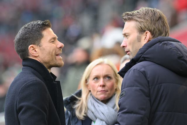 <p>Xabi Alonso (left) with Leverkusen sporting director Simon Rolfes</p>