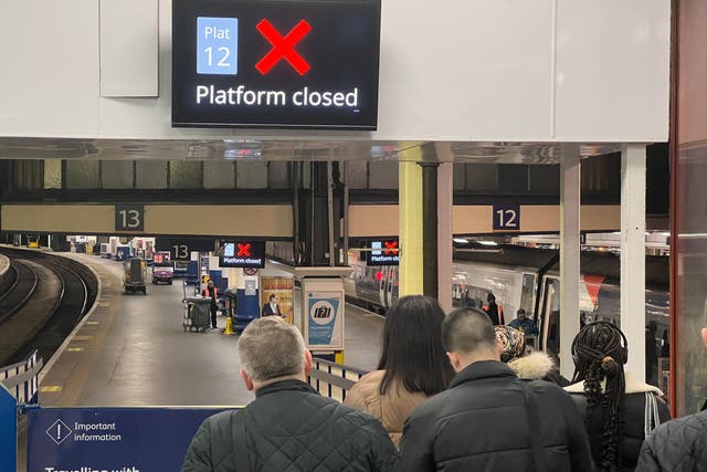 <p>Going places? Passengers at London Euston on Monday night, 12 February, waiting to board the final train to the West Midlands before Network Rail closed the line</p>