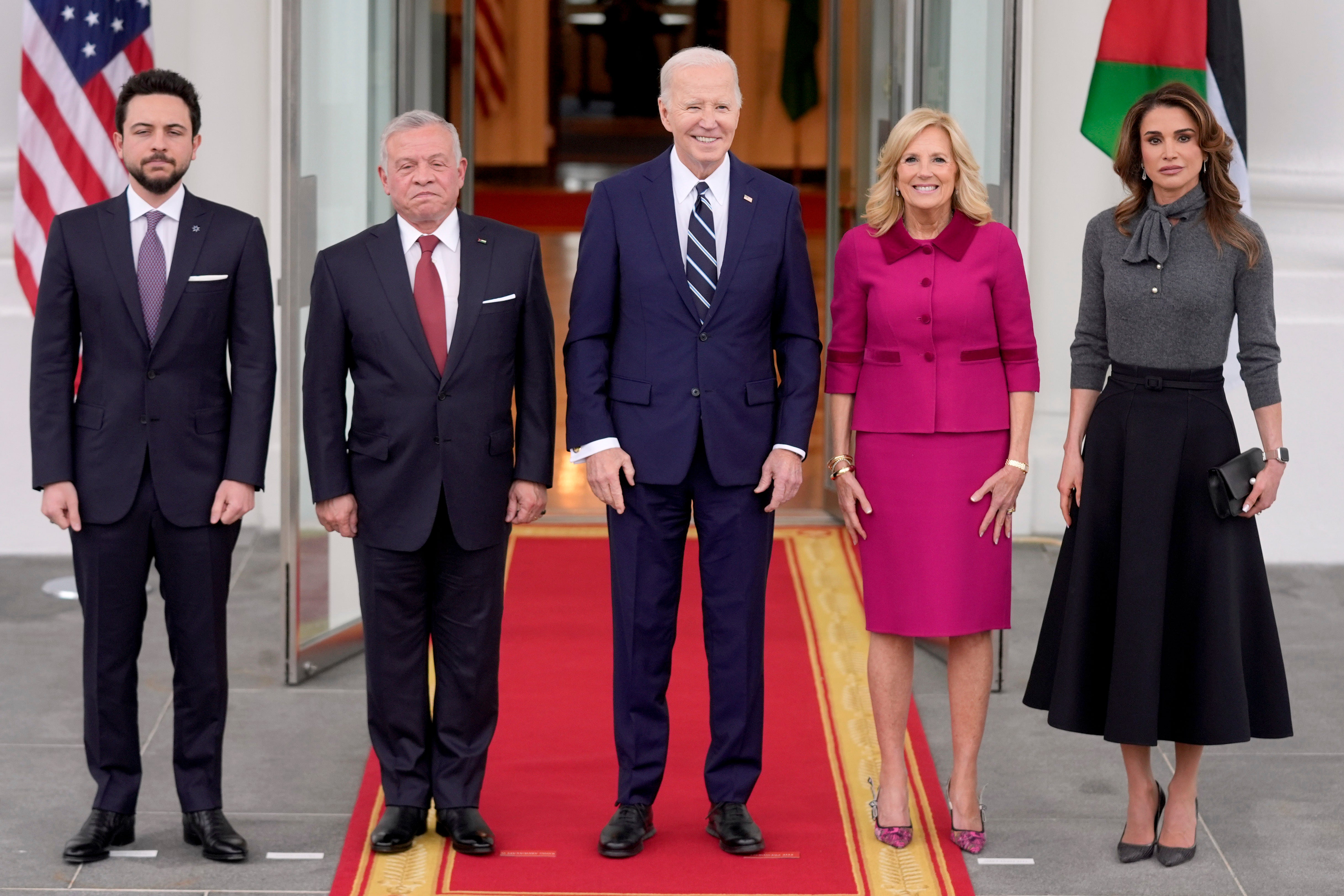 President Joe Biden, centre, and First Lady Jill Biden, second right, greet King Abdullah of Jordan, second left, Queen Rania, right, and Crown Prince Hussein, left, at the White House