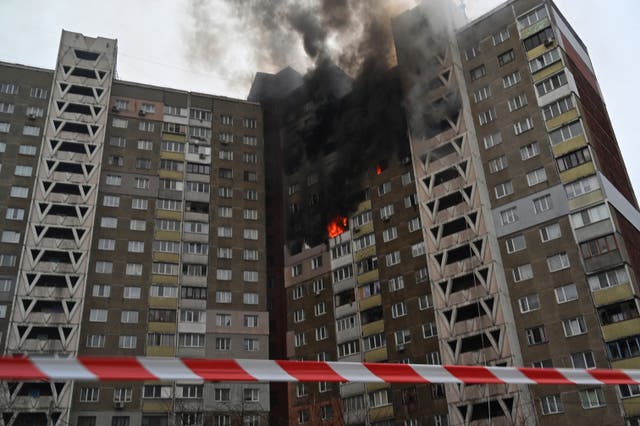 <p>This photograph shows a multi-storey residential building burning as a result of missile attack in Kyiv amid the Russian invasion of Ukraine</p>