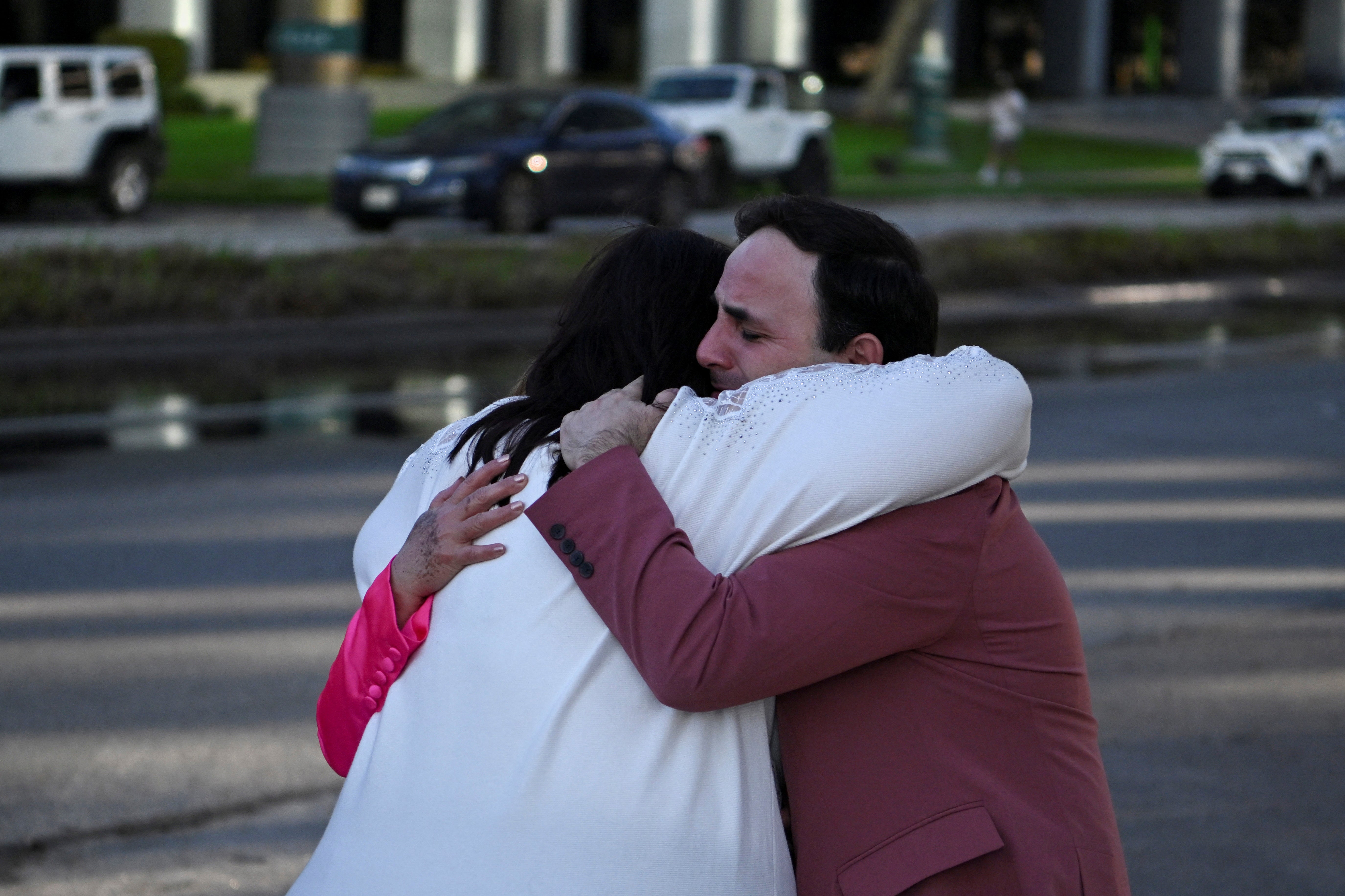 Survivors hug after the Lakewood Church shooting