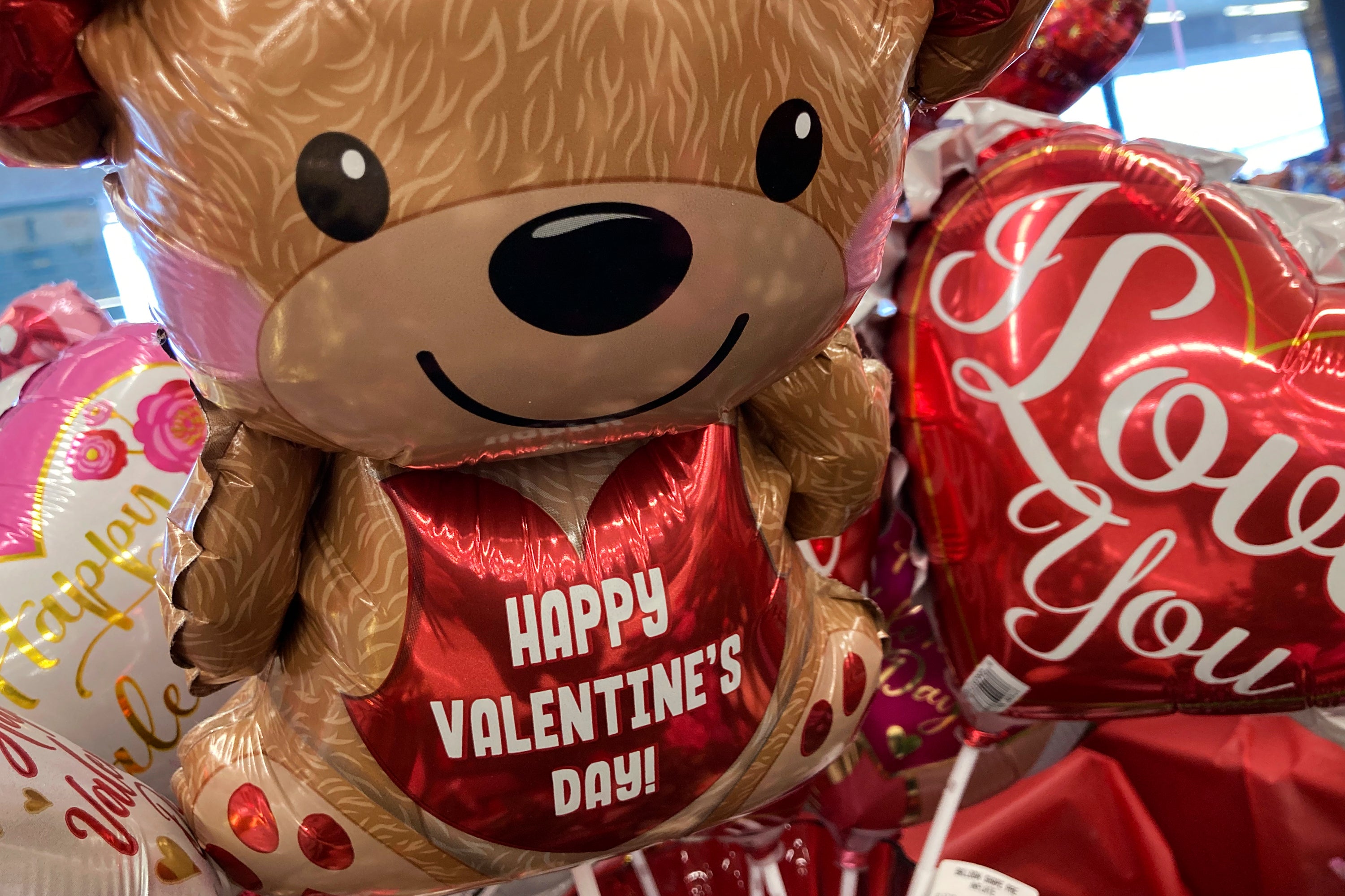 FILE - Valentine’s Day balloons are displayed at a grocery store in Buffalo Grove, Ill