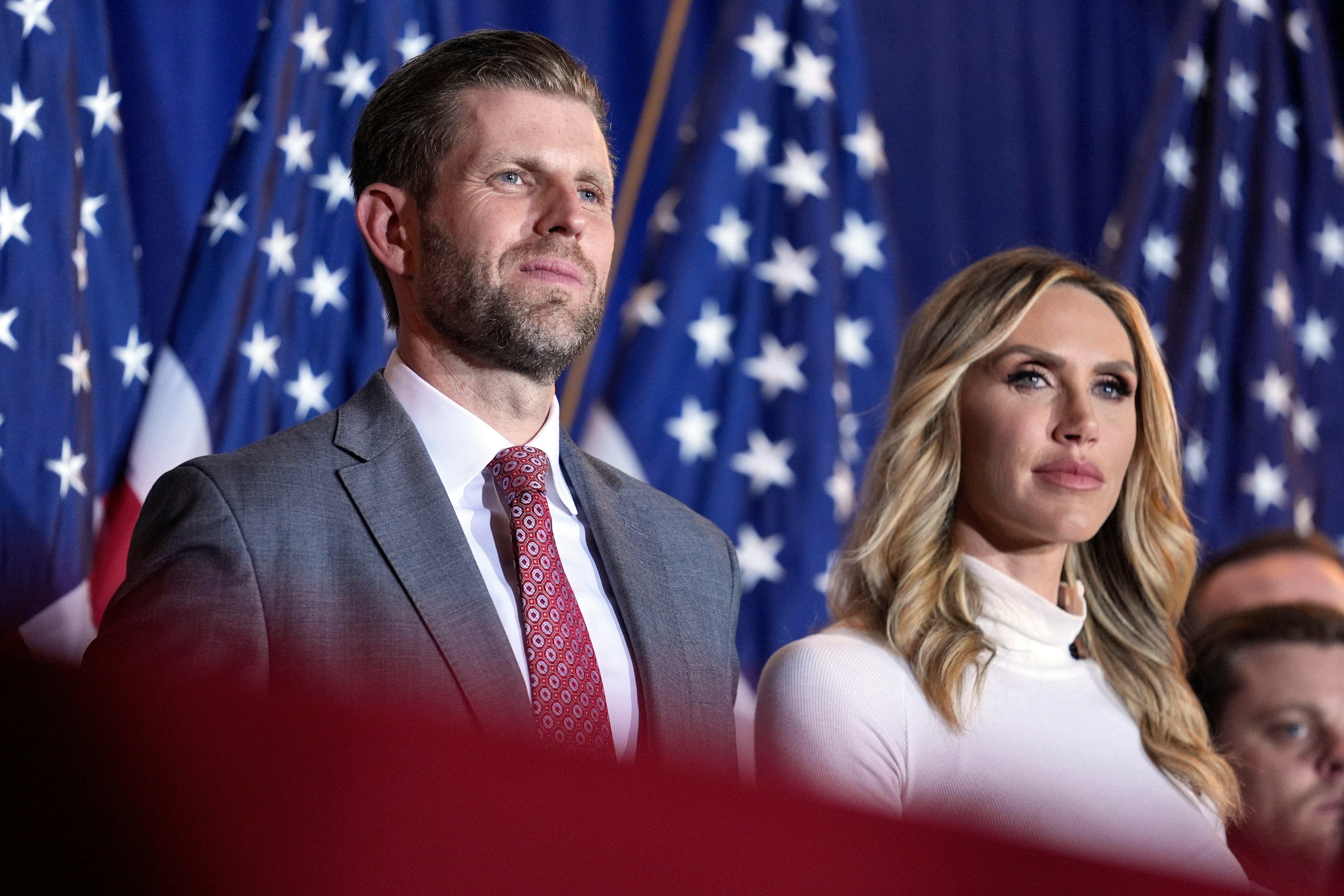 Eric and Lara Trump listen to Republican presidential candidate former President Donald Trump speak at a primary election night party in Nashua, N.H., Tuesday, Jan. 23, 2024. (AP Photo/Matt Rourke)