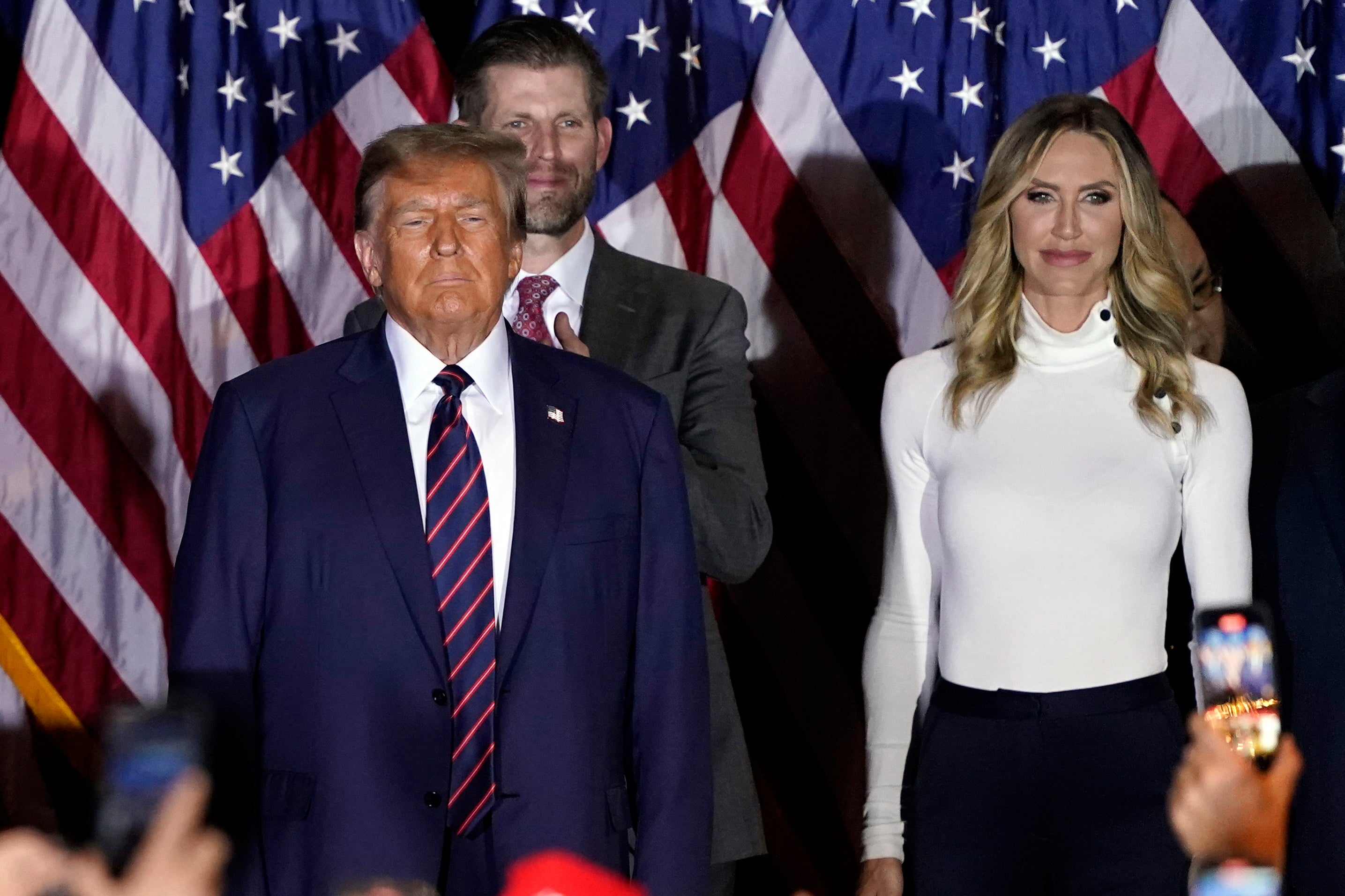 Republican presidential candidate former President Donald Trump arrives to speak at a primary election night party in Nashua, N.H., Tuesday, Jan. 23, 2024, with Eir and Lara Trump