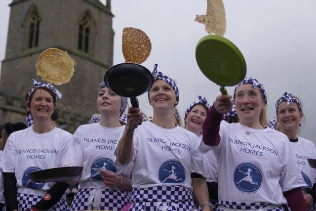 APTOPIX Britain Pancake Race