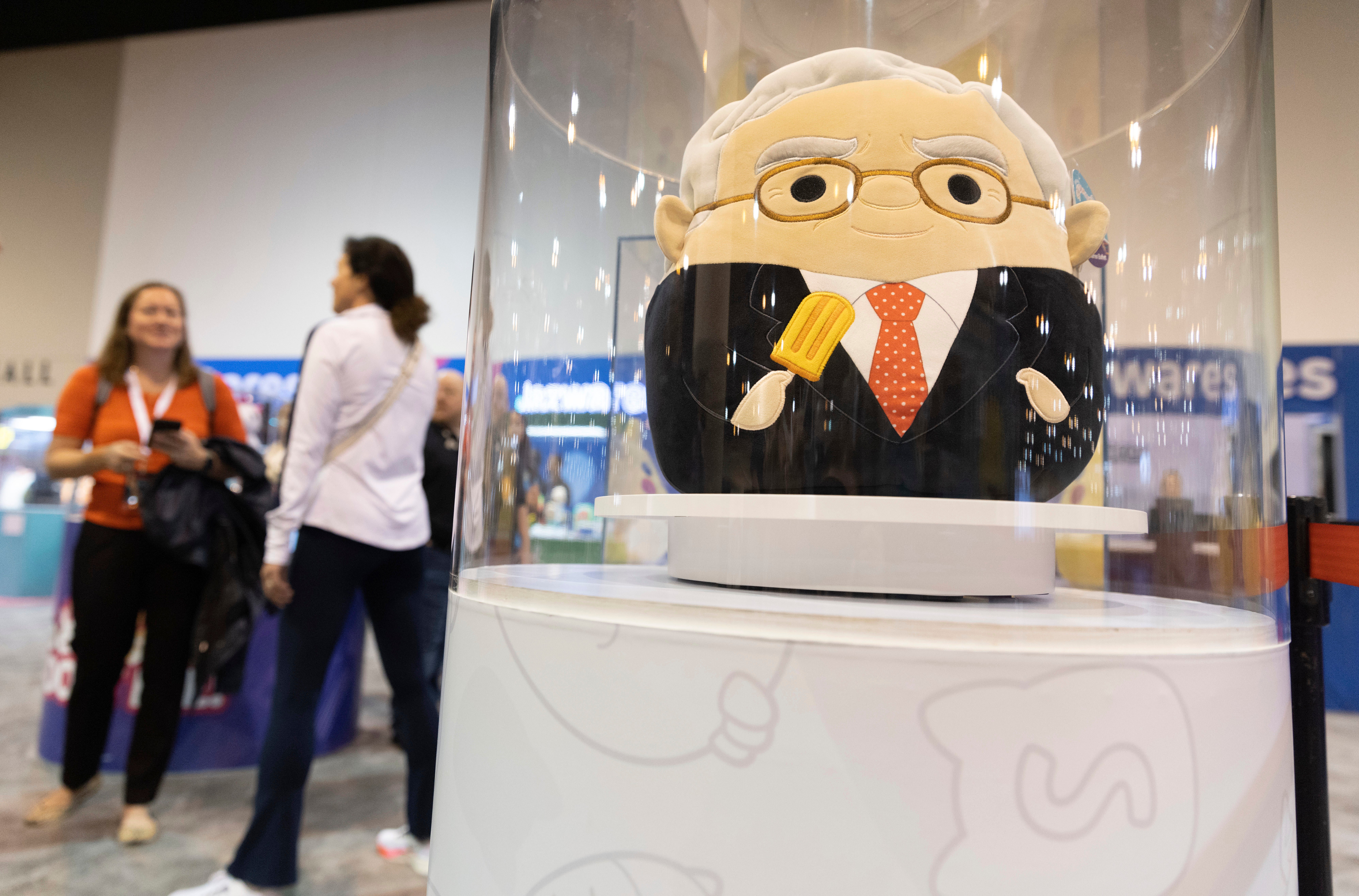 The Squishmallows booth sells toys modeled after Warren Buffett, pictured
