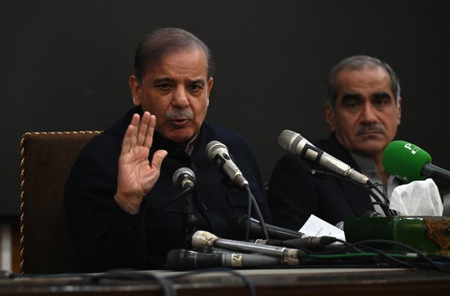 <p>Pakistan's former prime minister and leader of the Pakistan Muslim League-Nawaz (PML-N) party Shehbaz Sharif (L) speaks during a press conference in Lahore, Pakistan, 13 Feburay 2024</p>