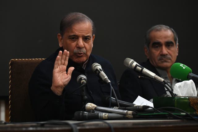 <p>Pakistan's former prime minister and leader of the Pakistan Muslim League-Nawaz (PML-N) party Shehbaz Sharif (L) speaks during a press conference in Lahore, Pakistan, 13 Feburay 2024</p>