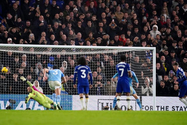 Chelsea’s Cole Palmer, right, scores against former club Manchester City (John Walton/PA)