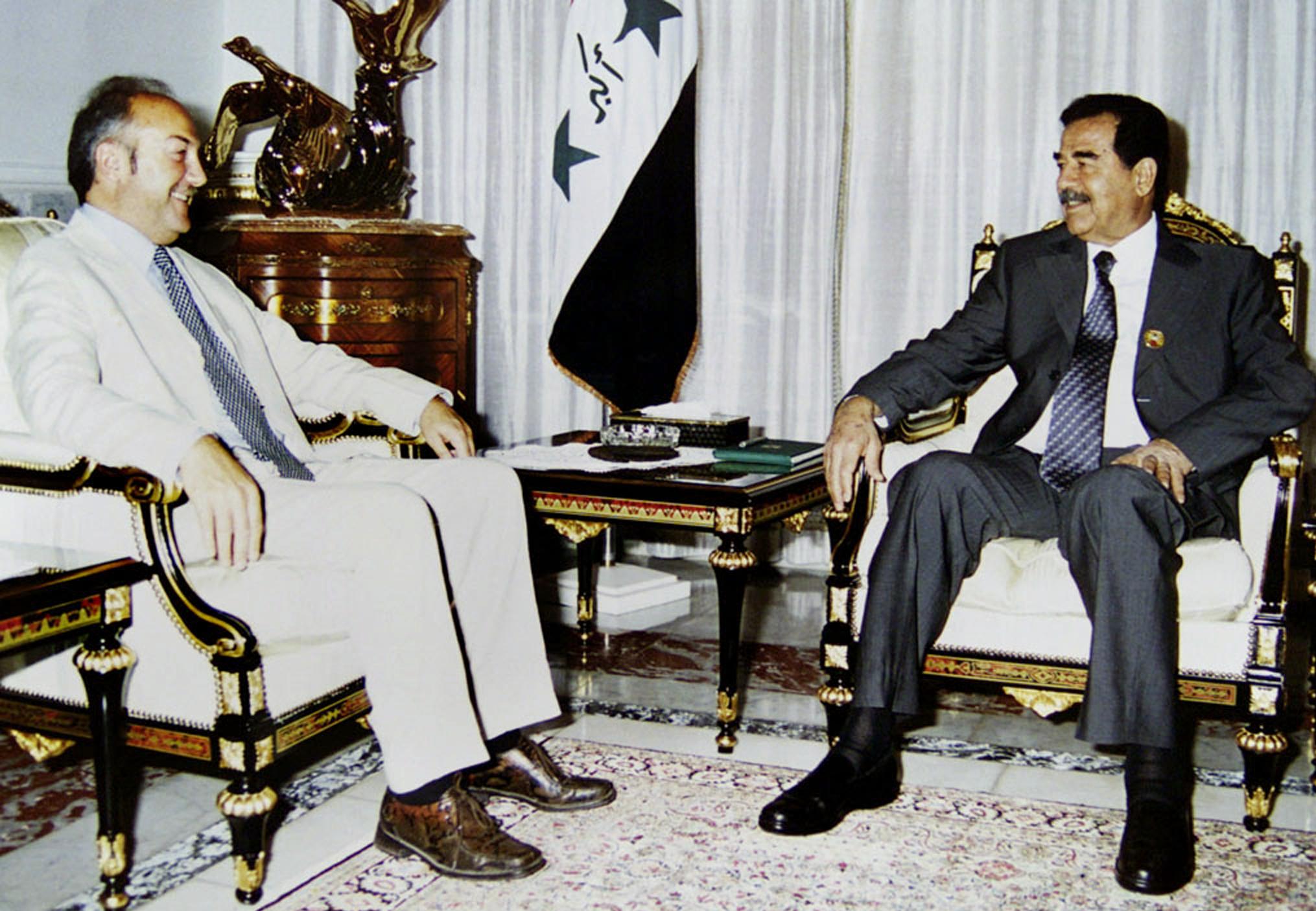 <p>Galloway sits with Saddam Hussein in a meeting with the Iraqi dictator condemned by many in the West </p>
